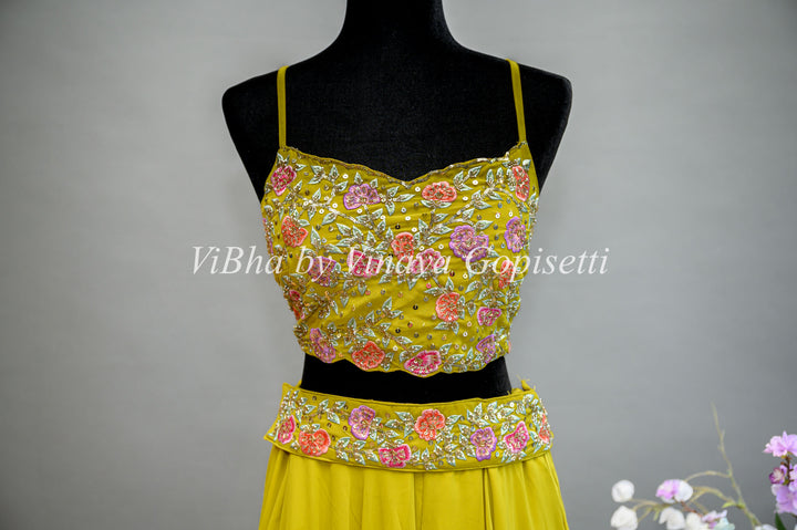 Citrus Green Lehenga with Embroidered Sleeveless Blouse and detachable Cape