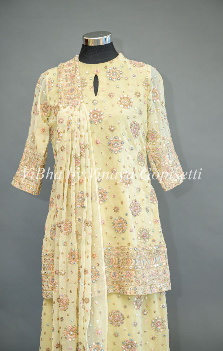 Pastel Yellow Embroidered Sharara Set With Choker Dupatta And Matching Potli Bag