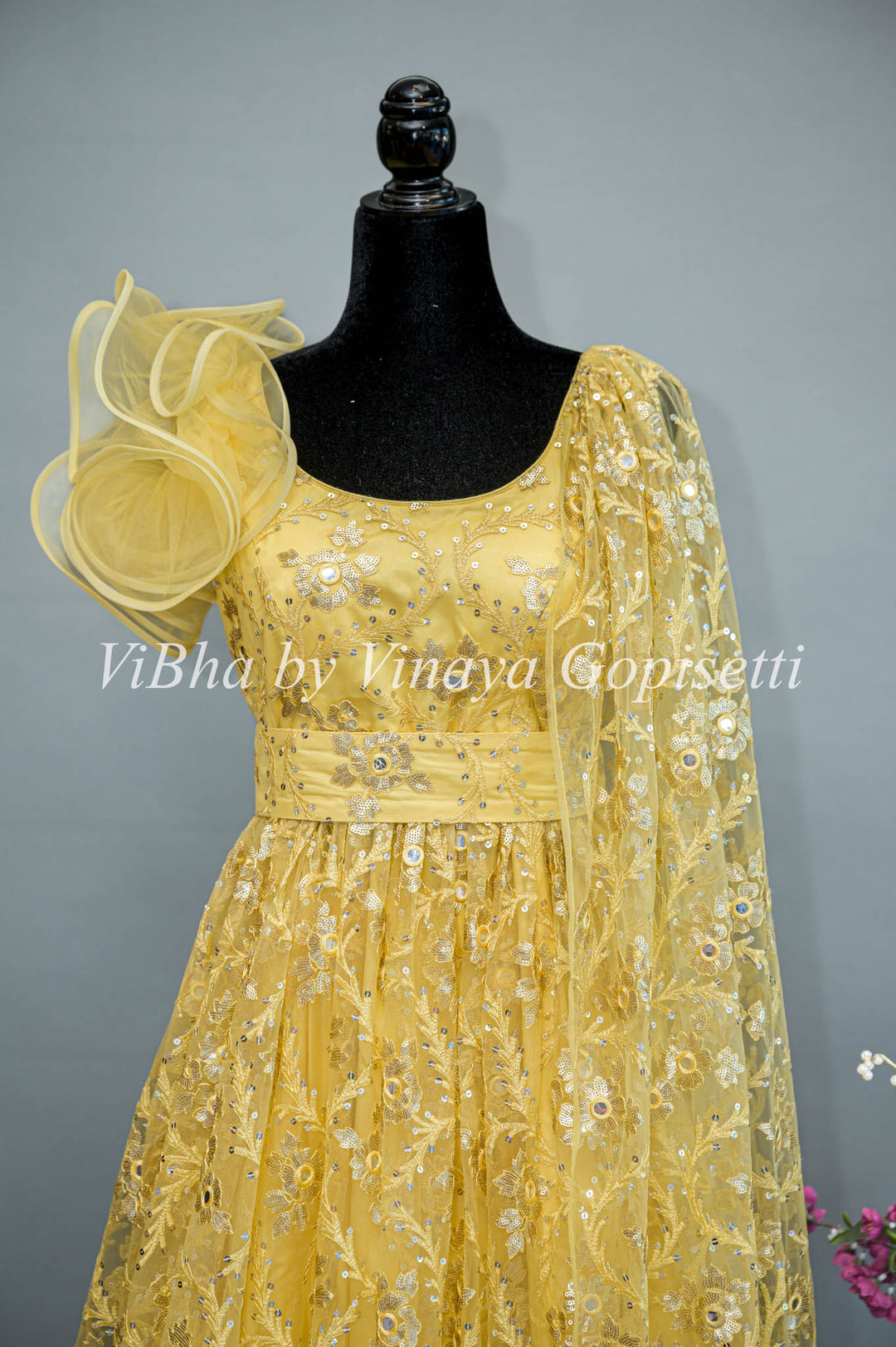 Yellow Net Embroidered One Side Cape Sleeve Gown