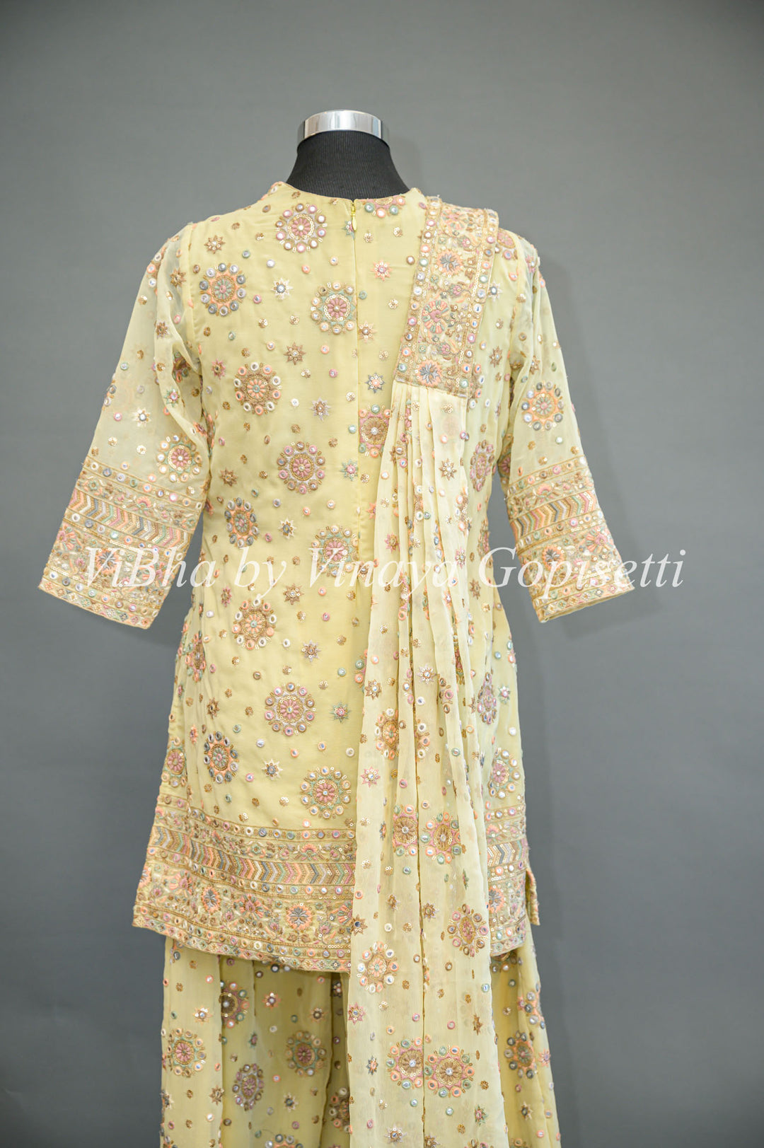 Pastel Yellow Embroidered Sharara Set With Choker Dupatta And Matching Potli Bag