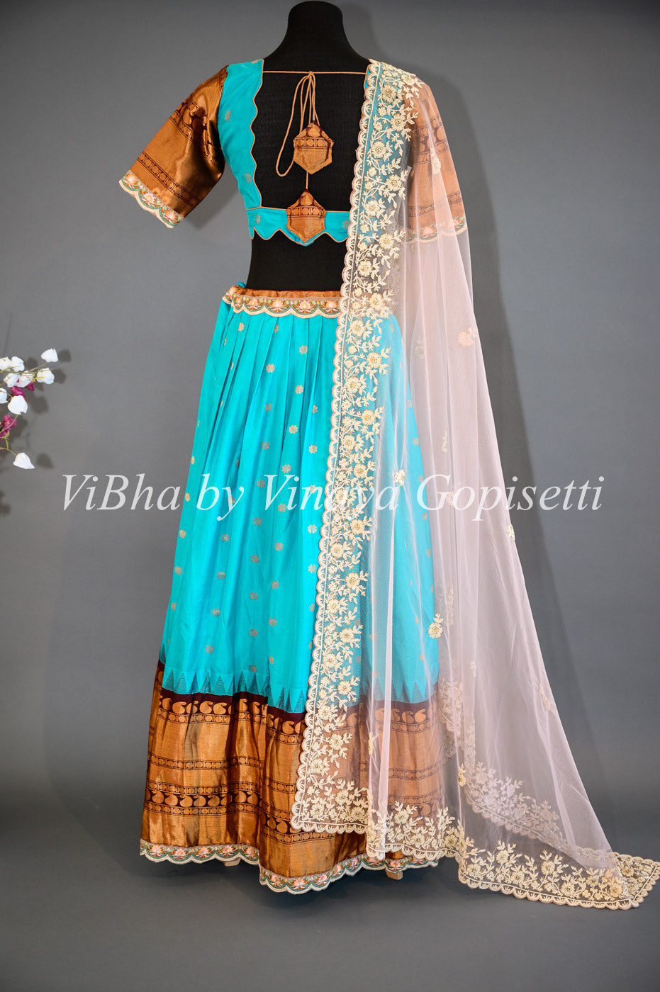 Dark Sky Blue and Brown Gadwal Silk Lehenga with Embroidered Borders And Peach Net Embroidered  Dupatta