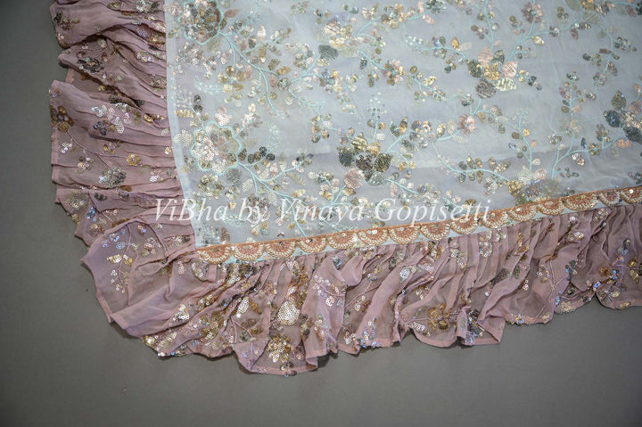 Pastel Blue And Mauve Georgette Sequins Ruffle Border Saree And Blouse