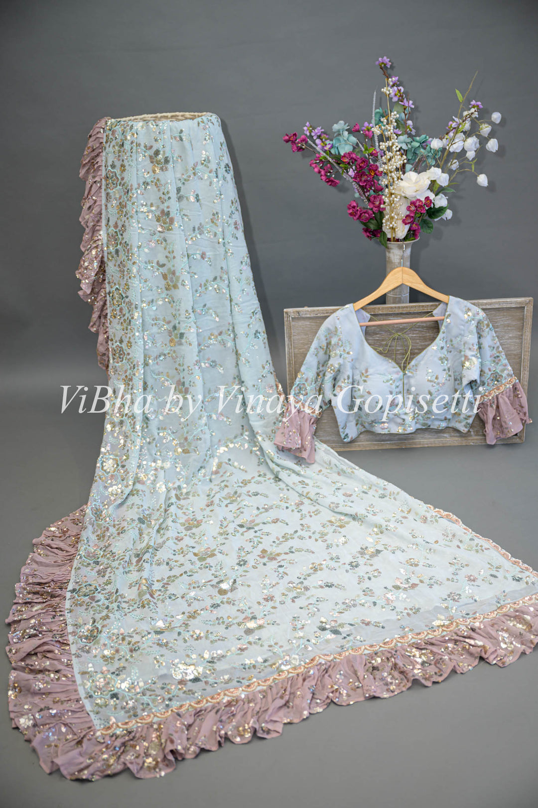 Pastel Blue And Mauve Georgette Sequins Ruffle Border Saree And Blouse