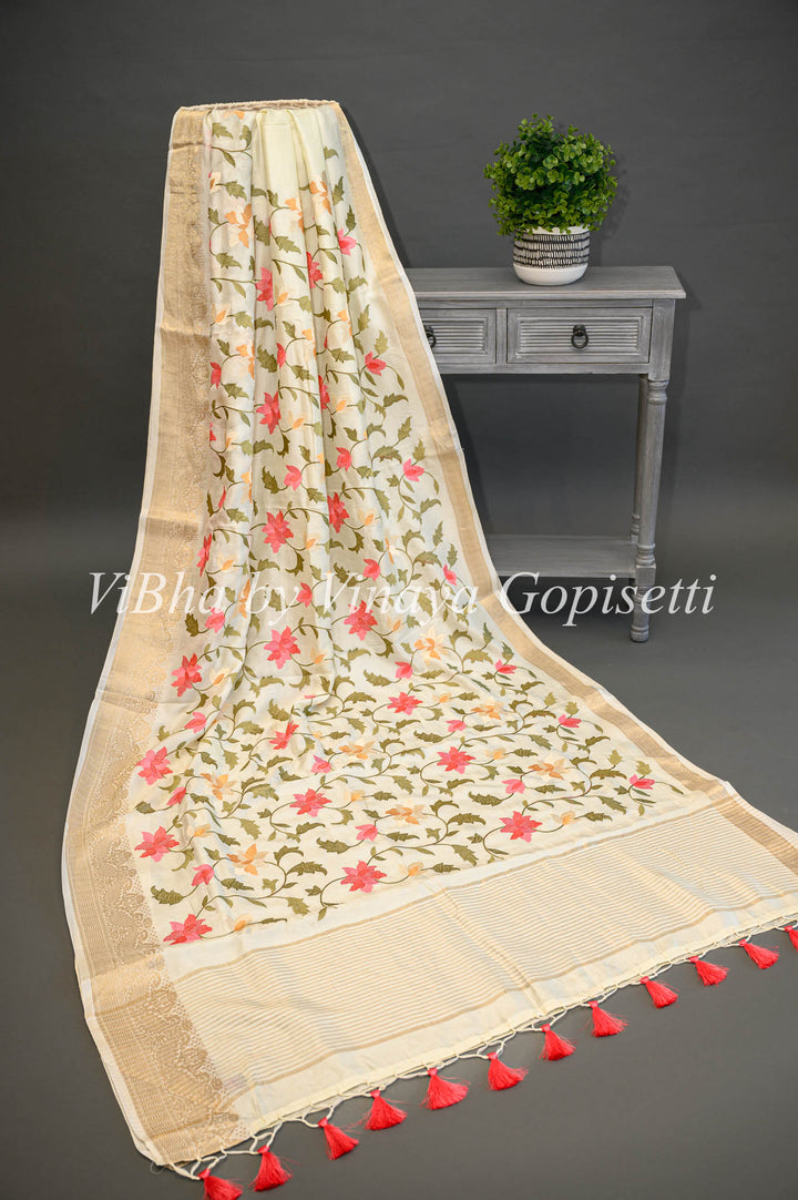 Off -White Banarasi Silk Saree And Blouse With Floral Thread Embroidery.