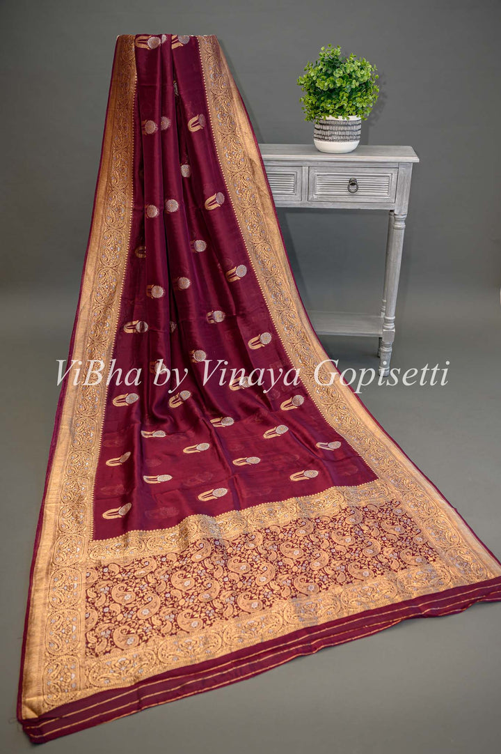 Burgundy Banarasi Kora Silk Saree With Gold And Silver Motifs and Borders