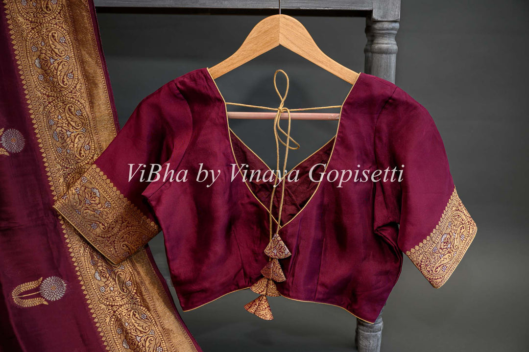 Burgundy Banarasi Kora Silk Saree With Gold And Silver Motifs and Borders