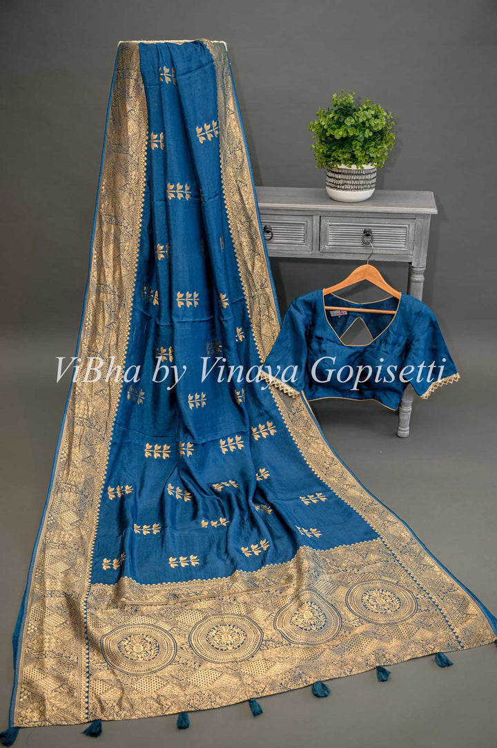 Teal Blue Benares Silk Saree And Blouse With Flower Motifs.