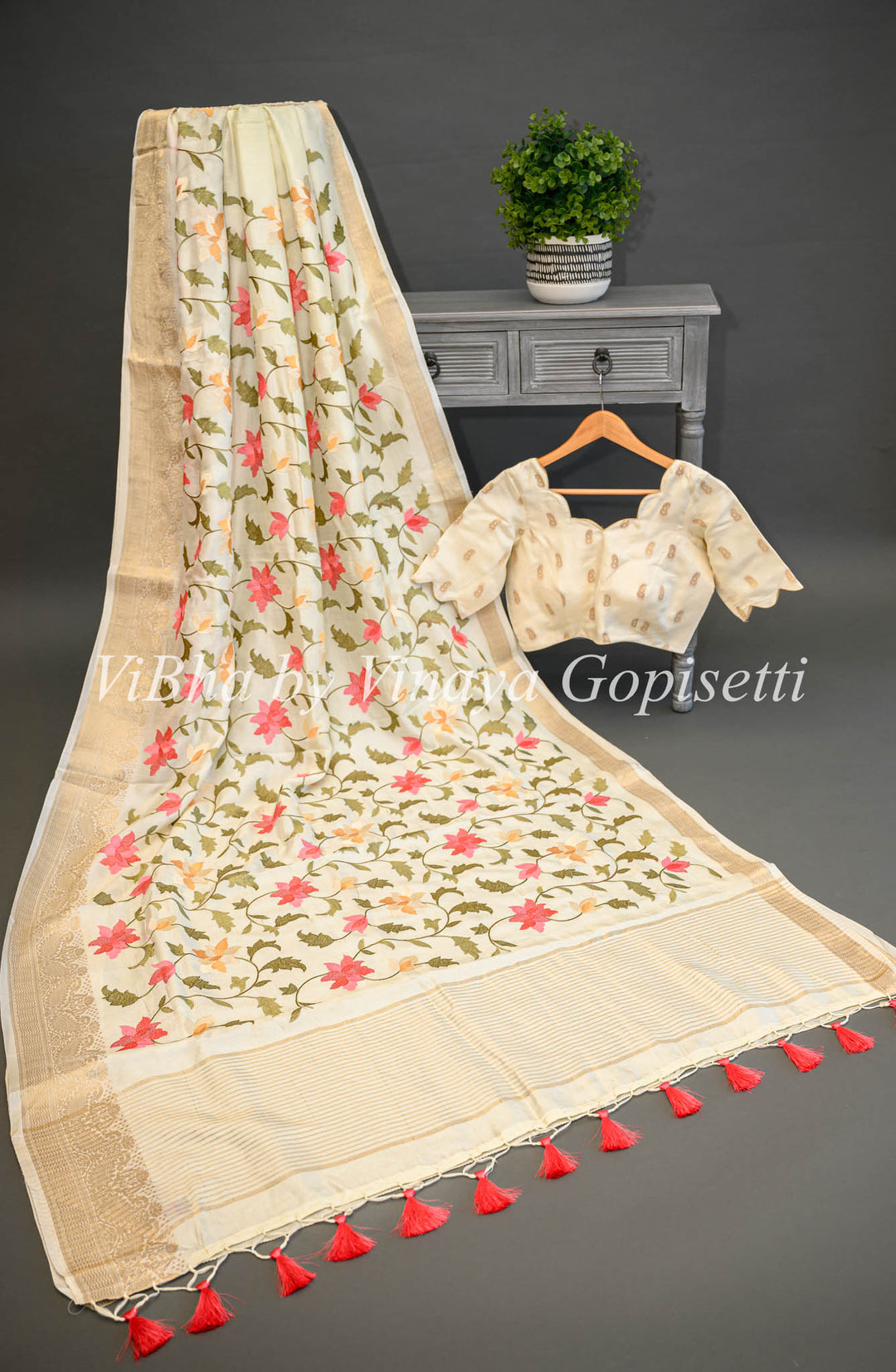 Off -White Banarasi Silk Saree And Blouse With Floral Thread Embroidery.