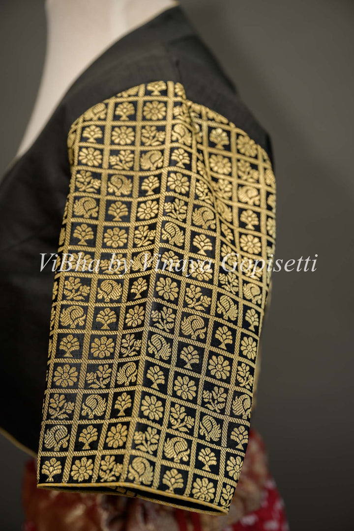 Black hand painted blouse with embroidery and Benares brocade sleeves.