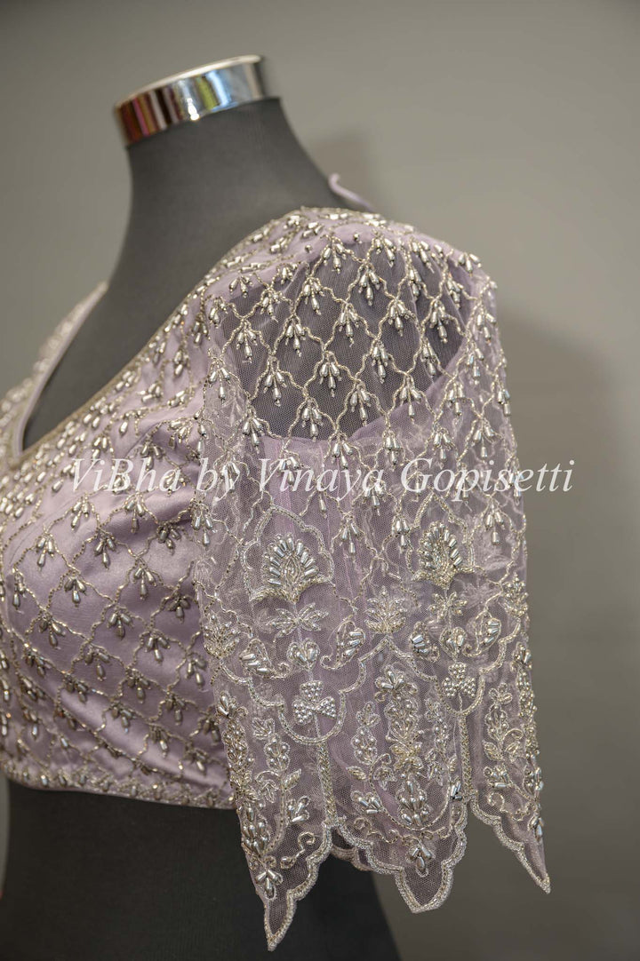 Pastel Lavender Net Blouse With Silver Zari And Crystal Embroidery.