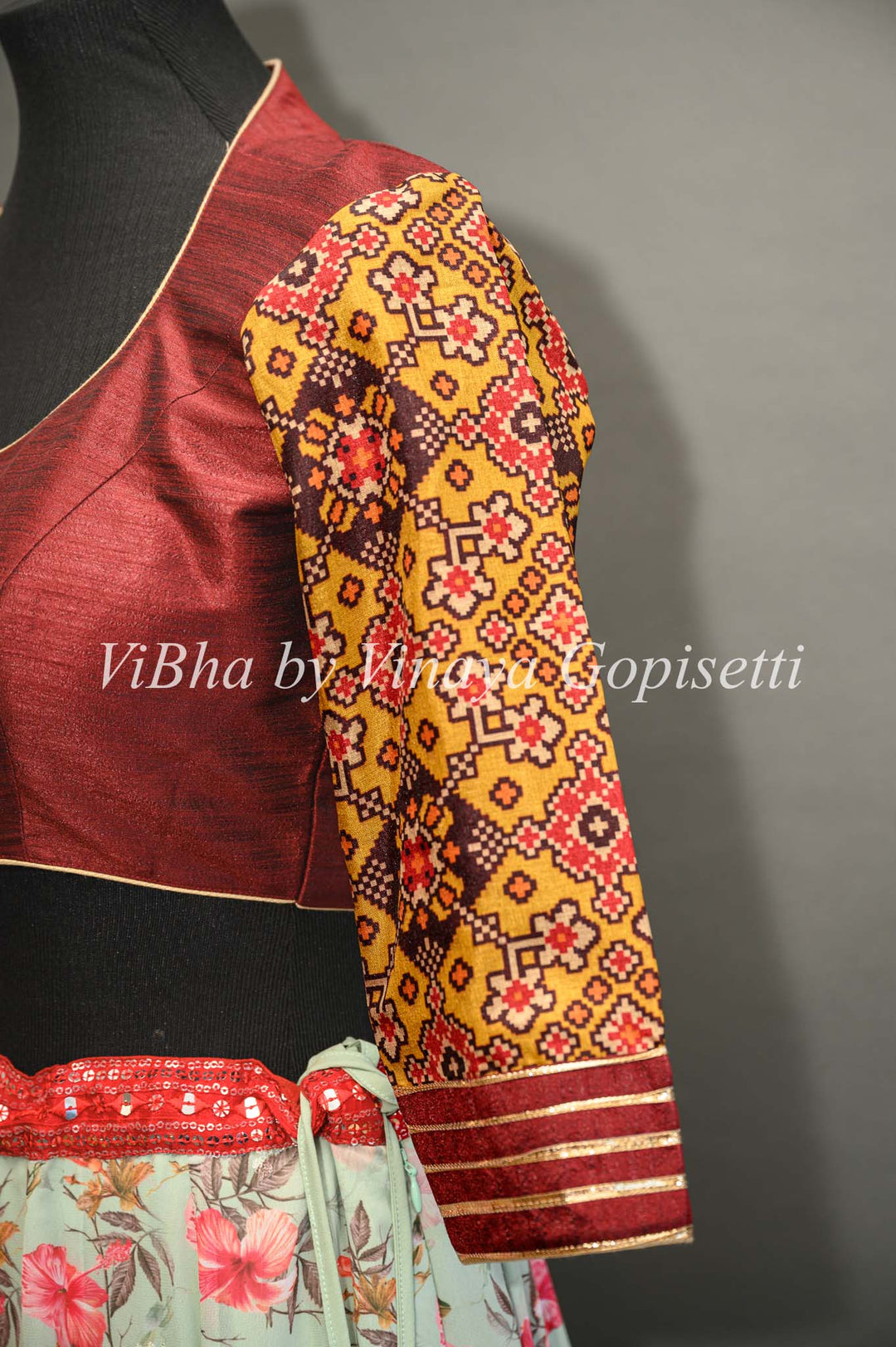 Maroon hand painted blouse with embroidery and patola sleeves