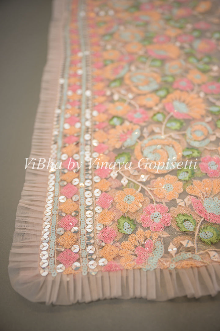 Pastel Peach Net Floral Embroidered Saree And Blouse