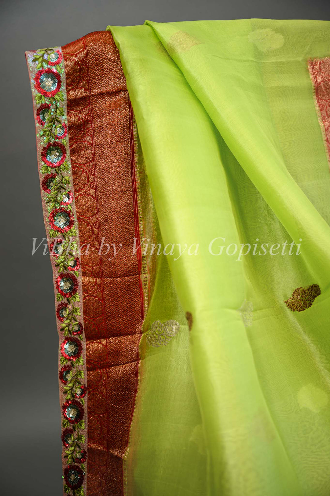 Parrot Green and Red Banarasi Organza Saree Embellished With Embroidered Borders