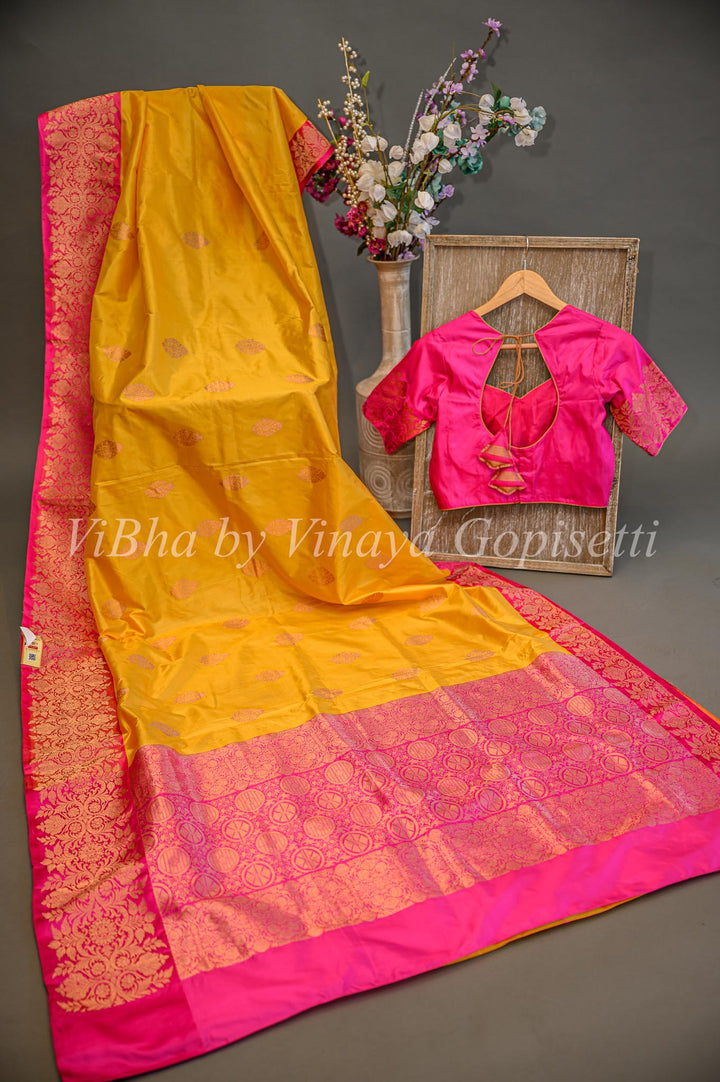 Yellow and Rani Pink Benares Katan Silk Saree And Blouse
