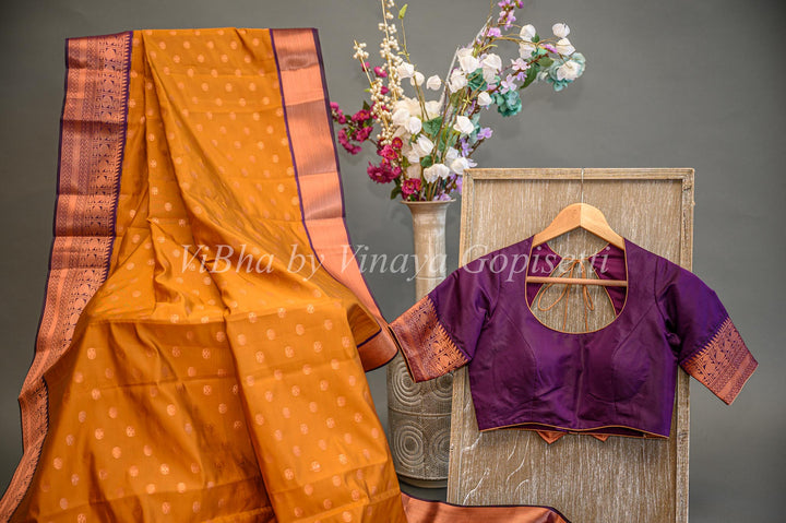 Deep Mustard And Purple Kanchi Silk Saree And Blouse With Copper Zari