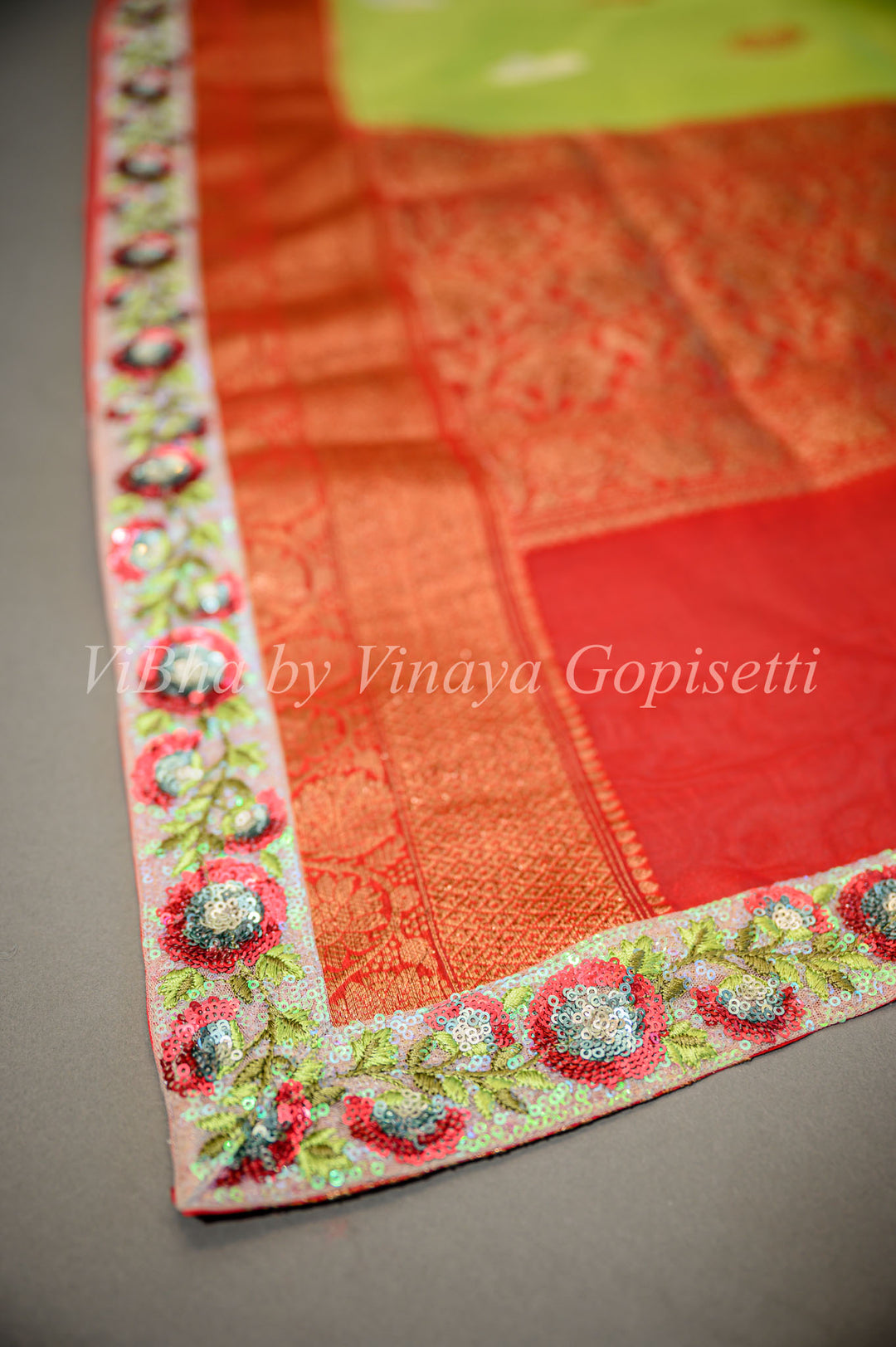 Parrot Green and Red Banarasi Organza Saree Embellished With Embroidered Borders
