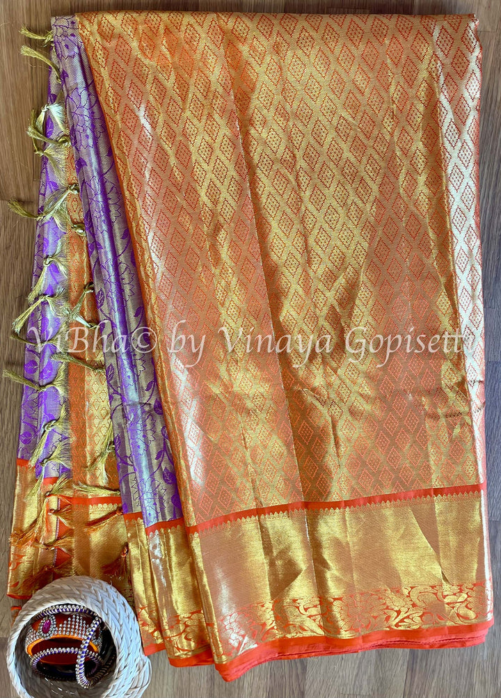 Purple and orange floral tissue Kanjivaram Silk Saree and blouse.