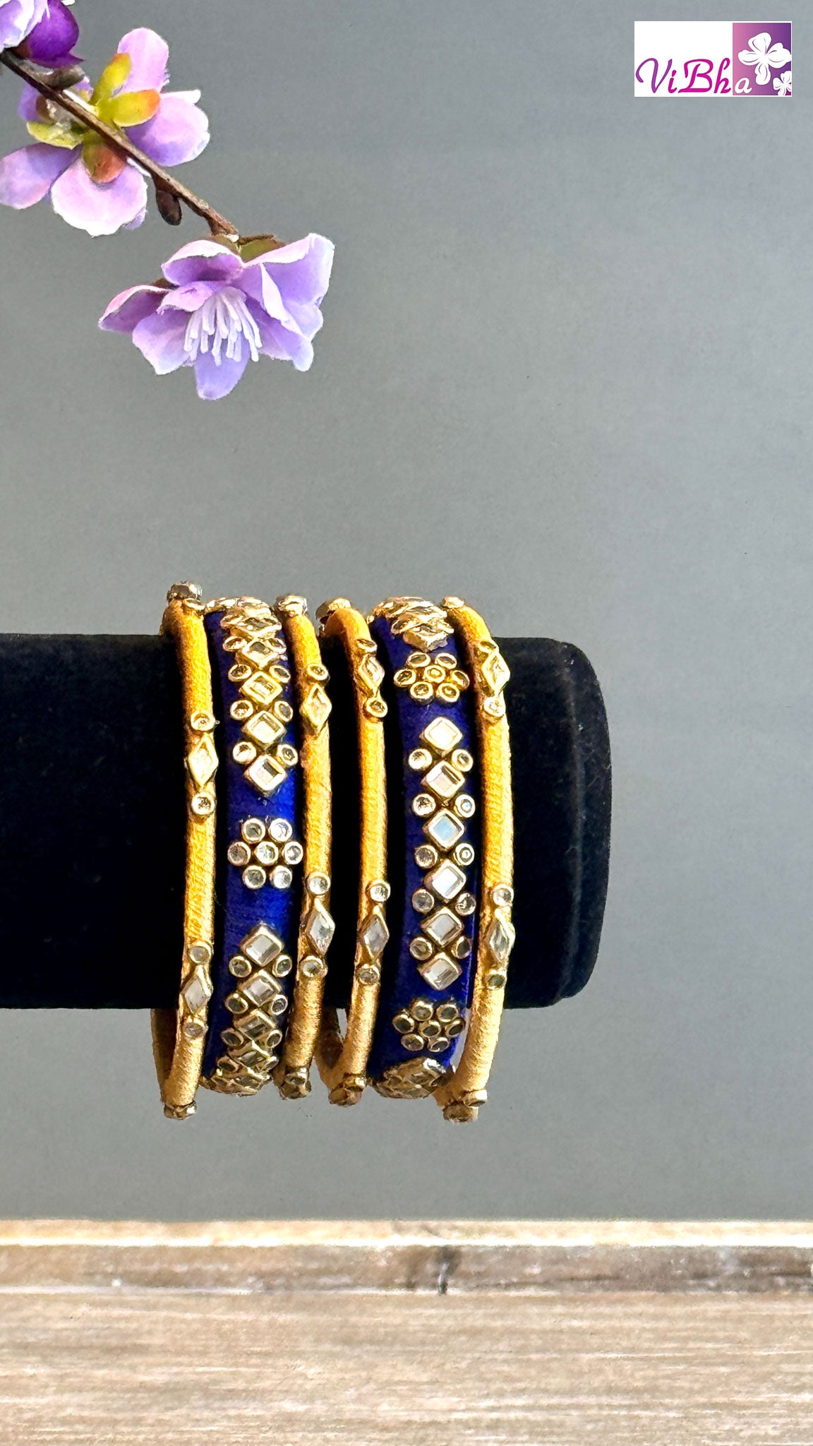 Woven silk thread bracelet with golden scarab insert