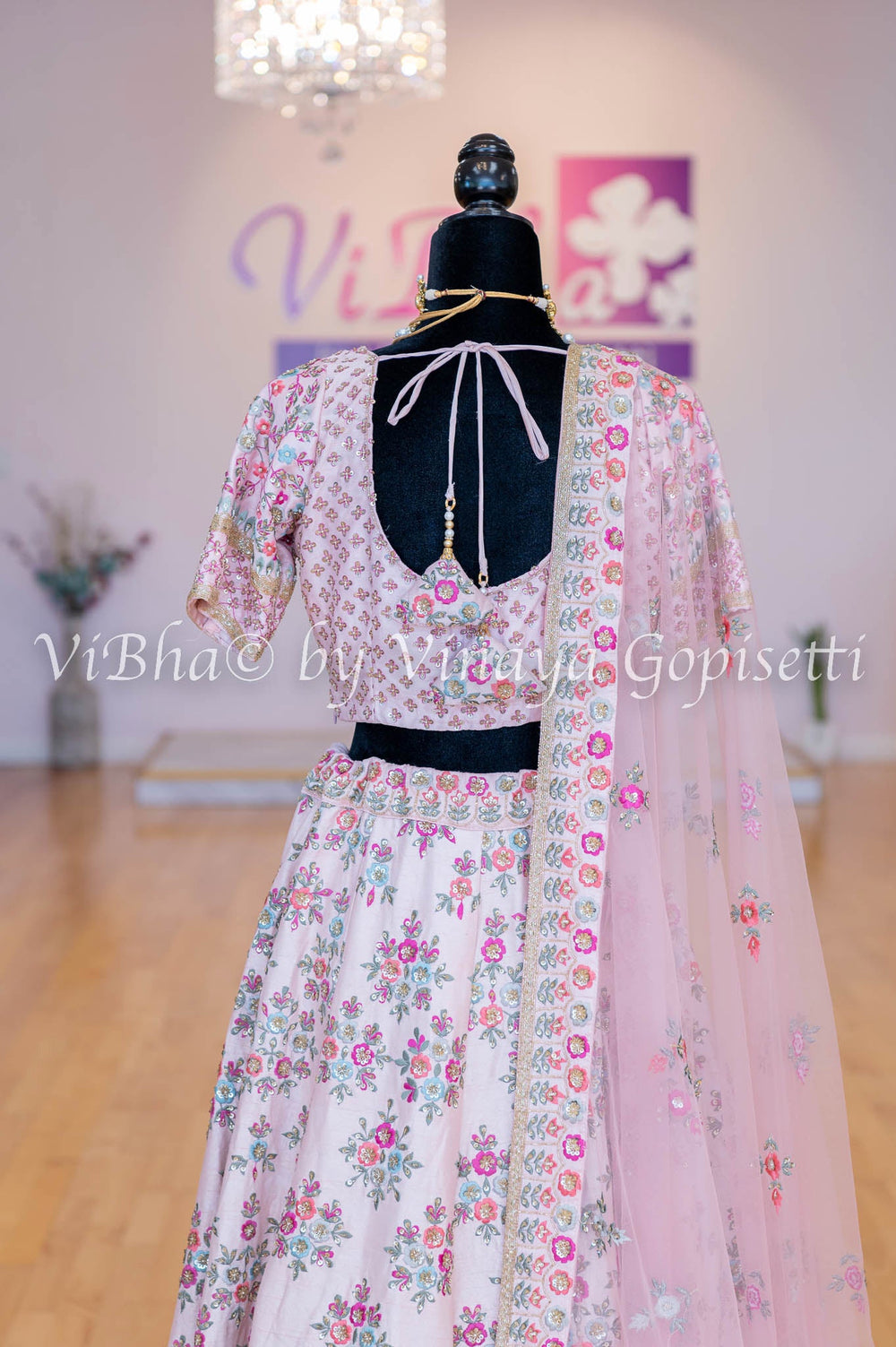 Light Pink Raw Silk Lehenga And Blouse With Fully Hand Embroidered In Floral Motifs And Borders With Net Dupatta