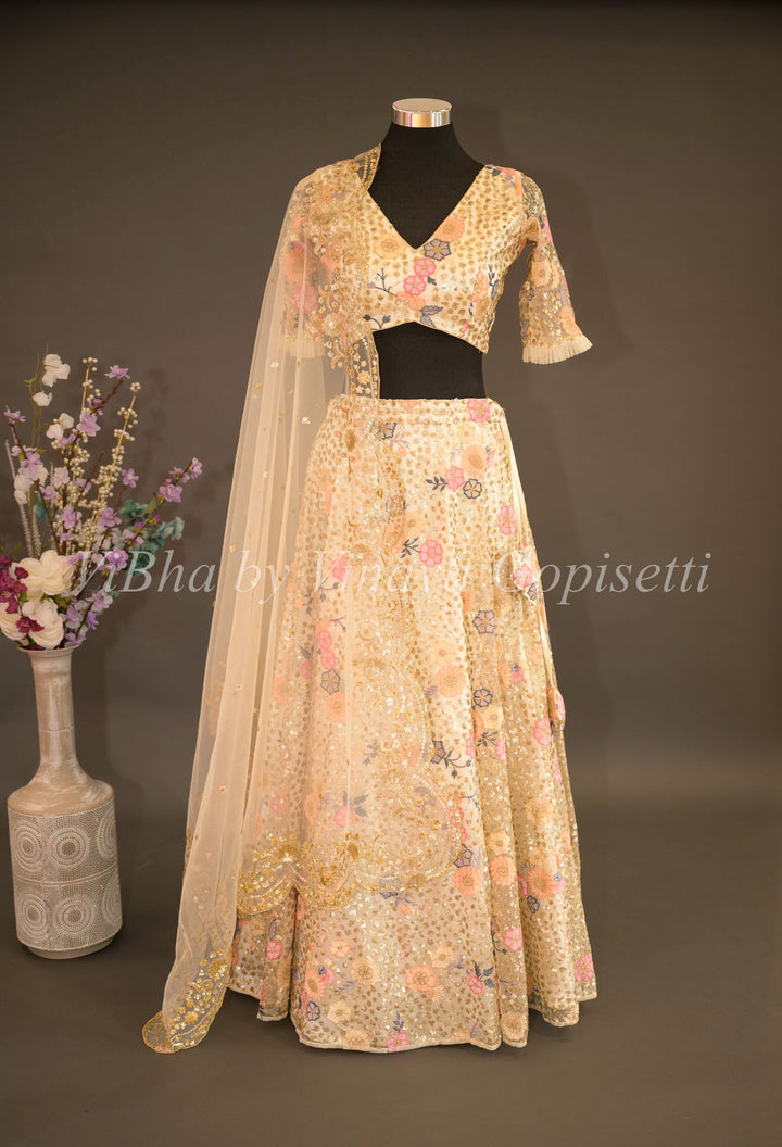 Bridal Lehengas - Ivory Color Net Lehenga Set With Sequins And Multicolor Zari Embroidery