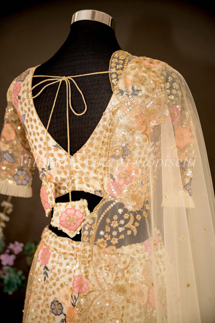 Bridal Lehengas - Ivory Color Net Lehenga Set With Sequins And Multicolor Zari Embroidery