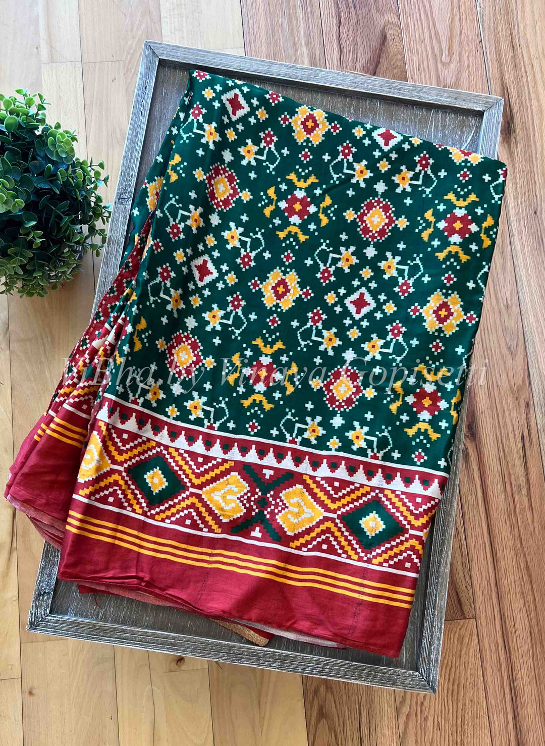 https://www.vibha.us/cdn/shop/products/sarees-green-and-red-modal-silk-patola-print-saree-1.jpg?v=1673692264&width=1080